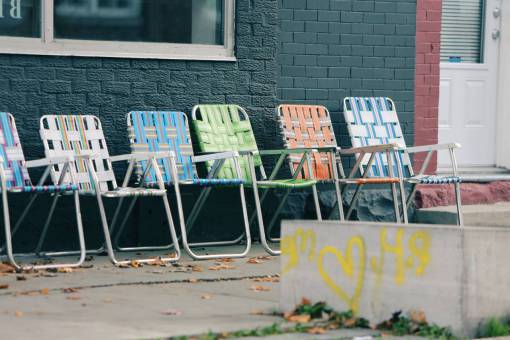 sidewalk lawn chairs  graffiti  paint  concrete  bricks  windows  door