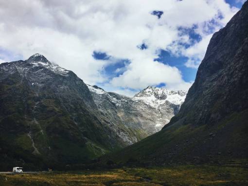 alpine nature  landscape  mountain  clouds  sky  grass  field