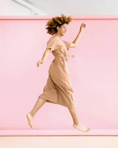 feet woman  jumping  pink  background  hair  dress  bare feet