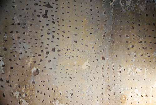 preparing-to-work Concrete wall with holes preparing for painting, close-up
