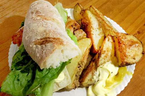 flavorful Ham and lettuce sandwich with fries