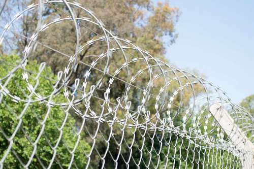 barrier Restricted area - fence with barbed wire