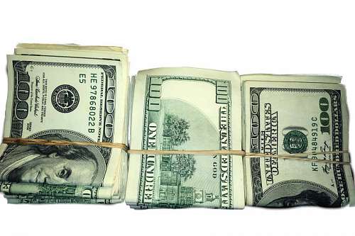 hundreds Stack of Rolled US Dollar Bills on white background