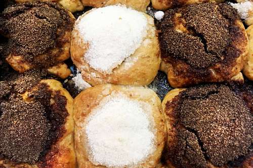 Tasty donuts with brown and white powdered suggar