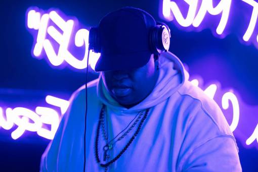 music DJ playing music in a nightclub