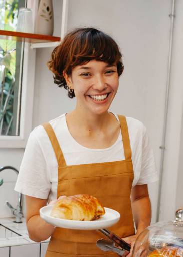 food Pastry woman with a croissant