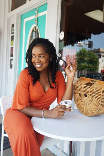 warm Woman smiling at a coffee store 