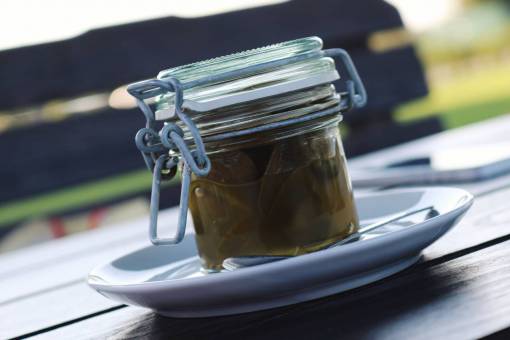 pickles jalapenos  pickled  glass  jar  plate  table
