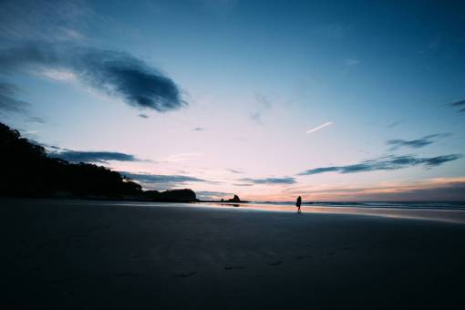 people  dark  sky  clouds  sunset  coast  beach
