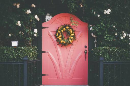 entrance pink  red  door  wreath  flowers  plants  bushes