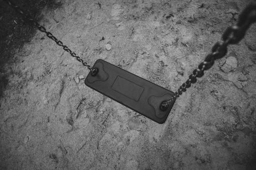 playground swing  playground  park  sand  black and white
