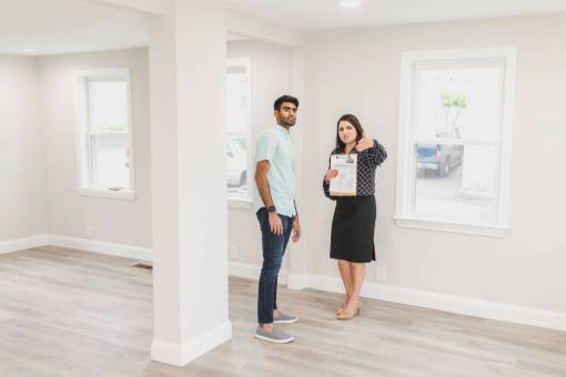 marketing  Real estate agent showing the interior of a house to his client