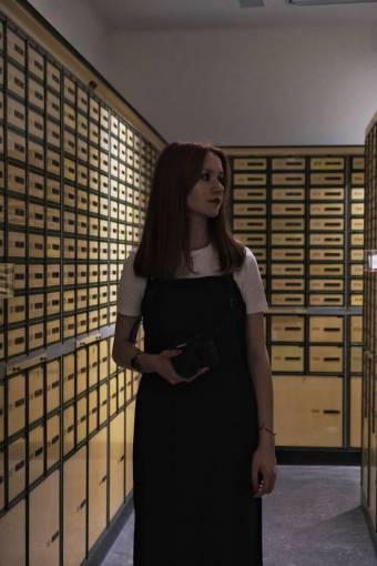 activities Woman entering her safe deposit box at the bank
