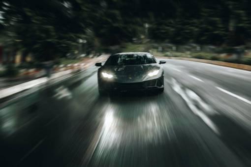 Black sports car speeding away