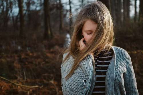 solitude Portrait of a young girl with her hair blowing in the wind