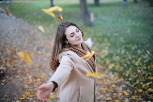 park Woman at a park dreaming with close eyes in autumn