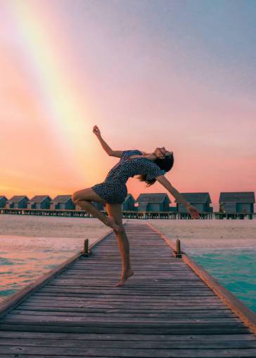 healthy-lifestyle lifestyles women nature jetty woman;beach;happy;vacations;rainbow outdoors sunset