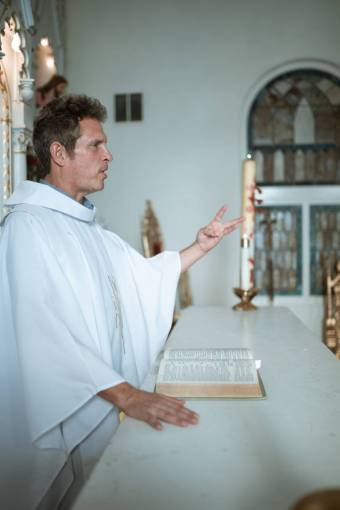 religion religion priest indoors adult men christianity one person