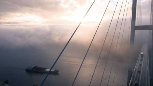 infrastructure  bridge  fog  boat  clouds  sky  road