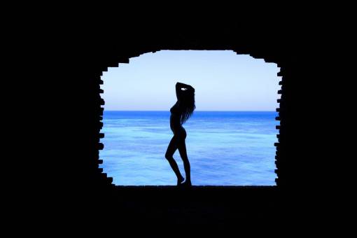 cave woman  bikini  silhouette  beach  sea  cave  travel