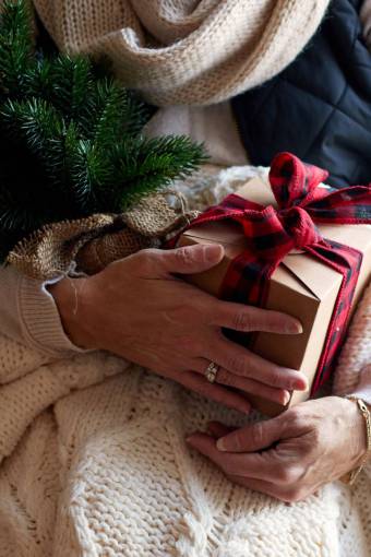 sweater woman  gift  box  giving  hands  holiday  christmas