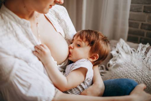 Woman breastfeeding her little son
