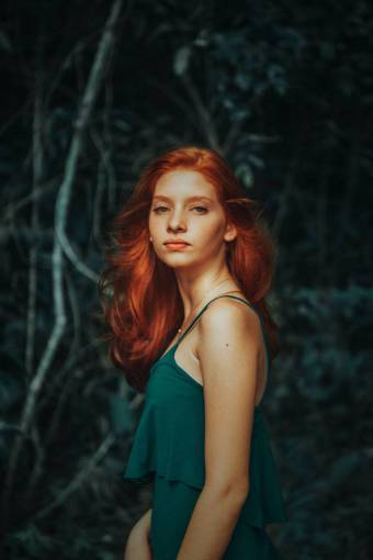 Young redhead woman looking at camera 
