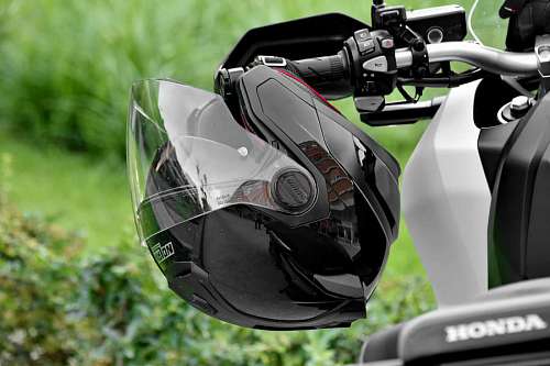 motorcycle steering wheel vehicle chrome helmet outdoors leisure championship competition drive 