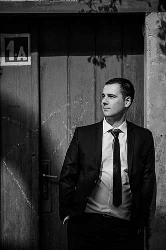 tuxedo suit tuxedo businessman monochrome handsome standing posing portrait 