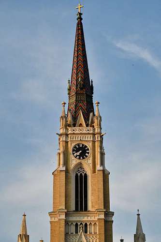 tower catholic church serbia clock christianity cathedral colorful architecture tourist attraction 