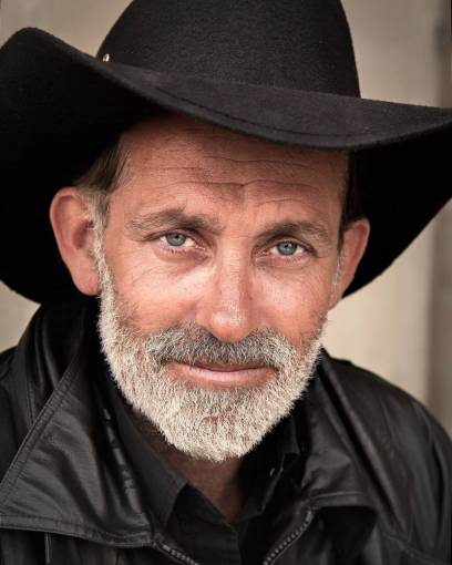 cowboy-boots cowboy  man  person  hat  beard  portrait  smile
