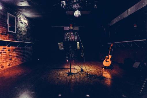 singer musician  guitar  singer  songwriter  bar  dive bar  microphone