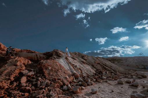 boulders nature  rocks  boulders  hills  sky  clouds  people