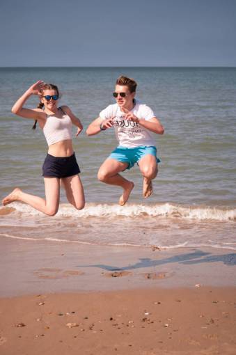 people  jumping  beach  boy  girl  fun  play