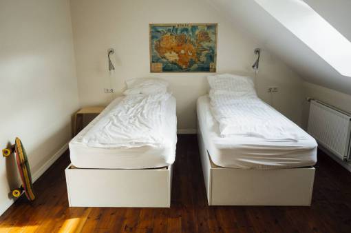 hostel room  beds  covers  sheets  pillows  hardwood  floors