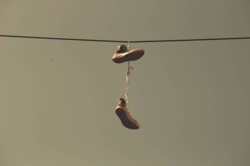 dutch-culture shoes  laces  power lines  city  sky

