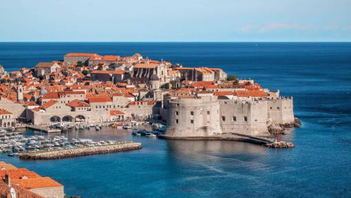 rooftops crotia  city  town  coast  ocean  water  boats