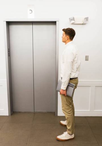 direction elevator  building  person  waiting  man  business  executive
