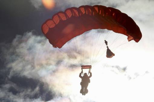 parachute parachute  sky  clouds  dark  silhouette  people  man