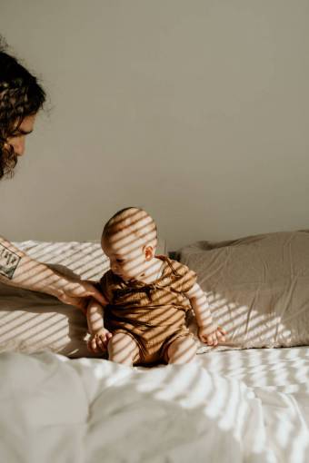 father Father with his baby at bed