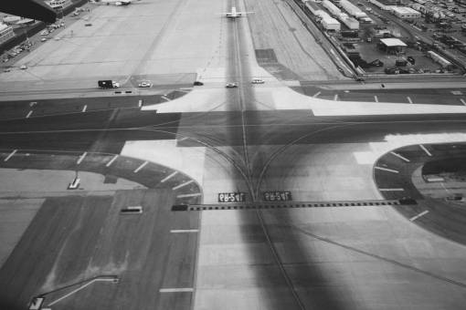 airport-terminal airport  runway  tarmac  airplanes  transportation  travel  black and white
