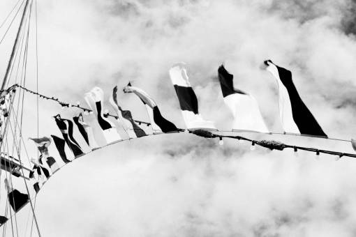 sailboat black and white  flags  string  fairy lights  ropes  sailboat  sky