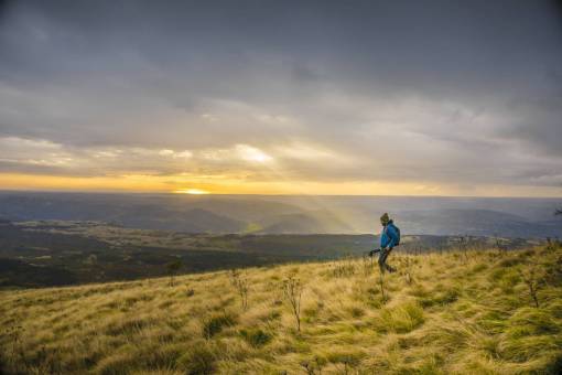 sunbeam guy  man  hiking  trekking  grass  fields  mountains