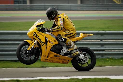 race motorcycle  bike  racing  racer  helmet  wheelie  race track