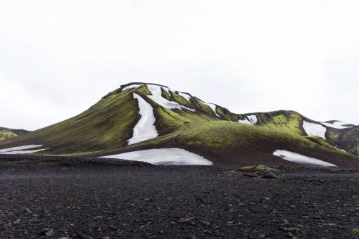 mud sky  mountains  hills  valleys  snow  green  grass