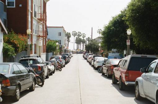 street  parking  cars  trucks  motorcycle  houses  apartments