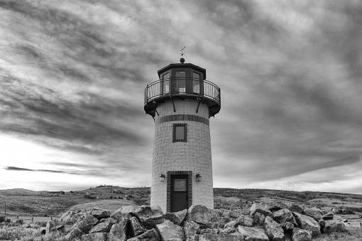 lighthouse grey  sky  clouds  lighthouse  door  rocks
