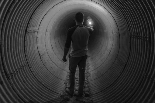 tunnel guy  flare  tunnel  light  people  black and white
