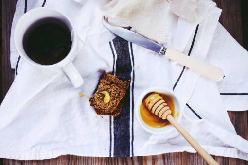 loaf-of-bread loaf  bread  knife  tea  cup  table  napkin