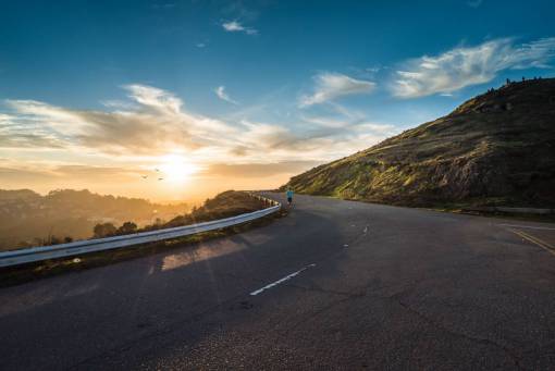 runner road  pavement  highway  sunset  sky  clouds  outdoors
